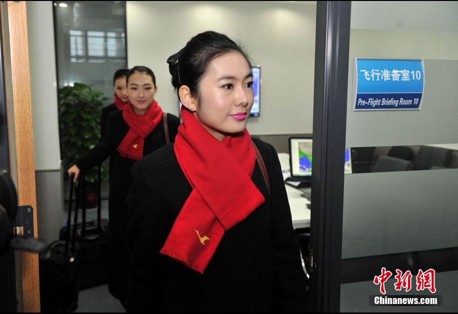 Airline stewardesses of Xiamen Air show their new uniforms on Feb. 6, 2015.