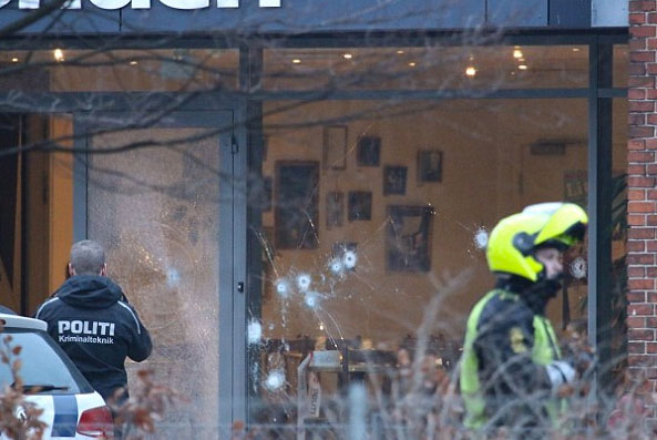 A massive manhunt is underway across Denmark after a gunman killed one man and wounded three police officers on Saturday afternoon at a cultural center in the downtown area of Copenhagen.