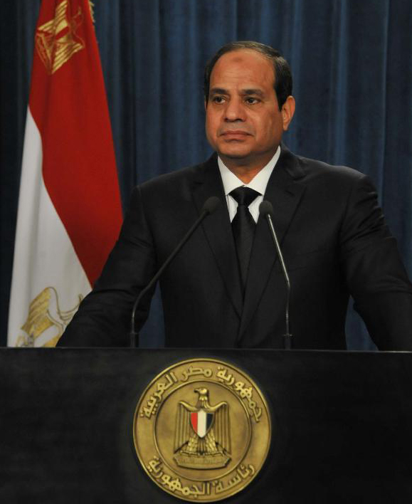 Photo released by Egyptian state-run news agency MENA shows Egyptian President Abdel Fattah al-Sisi delivers a TV speech after an urgent convention of National Defense Council in Cairo, Egypt, on Feb. 15, 2015. Egyptian President Abdel Fattah al-Sisi said early Monday that his country reserves the right to respond at the proper time to the killing of 21 Coptic Egyptians in Libya by Islamic State (IS) group.
