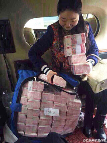 Liu, 42, was seen handing out 10,000-yuan bundles of cash as hongbao to seniors above the age of 60 around his hometown. [Weibo.com]