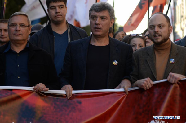 The archive photo taken on Sep. 21, 2014 shows Russian opposition leader Boris Nemtsov (2nd, R) attending the Peace March in Moscow, Russia. Russian opposition leader Boris Nemtsov was shot and killed near the city center on Feb. 28 (local time), 2015, Tass News Agency quoted government officials as saying.