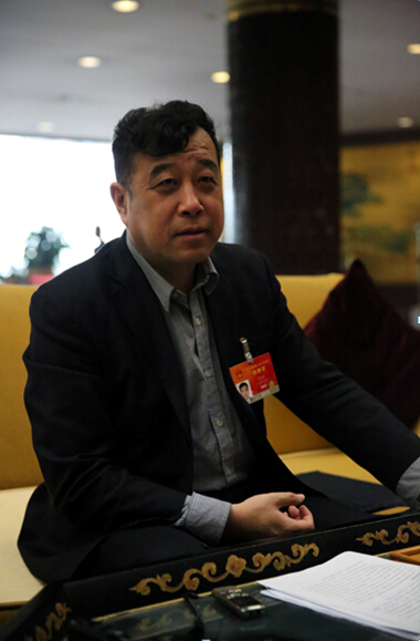 Li Yihu, a deputy to China's National People’s Congress and also a member of the Foreign Affairs Committee of the NPC. [Photo by He Shan/China.org.cn]