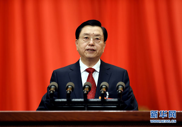 China's top legislator Zhang Dejiang delivers a work report at a a plenary meeting of theNational People's Congress' annual session in Beijing March 8, 2014.[Photo/Xinhua]