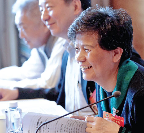 Xu Lin, a member of the CPPCC National Committee and director-general of the Confucius Institute headquarters, or Hanban－China's overseas Chinese-language teaching program - takes part in group discussion of the Government Work Report in Beijing last week. Zou Hong / China Daily