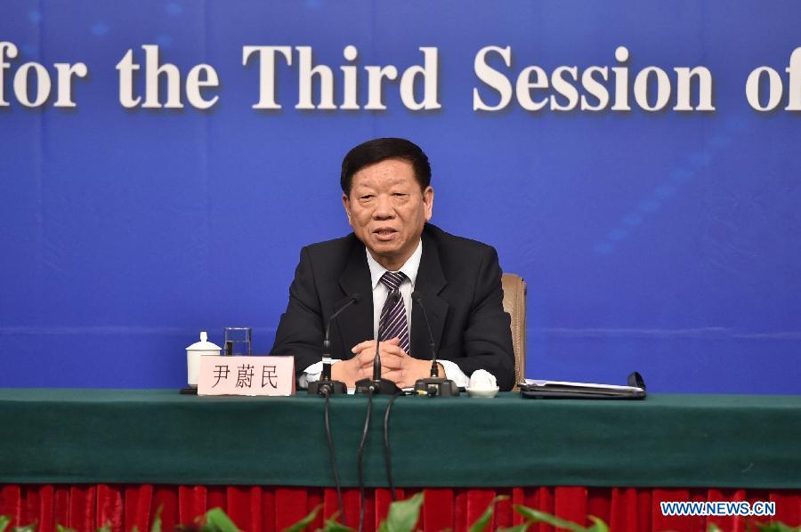 Yin Weimin, minister of human resources and social security, gives a press conference during the third session of China's 12th China's National People's Congress (NPC) in Beijing, capital of China, March 10, 2015.[Photo/Xinhua]