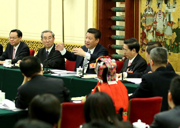 President Xi Jinping leads a discussion with deputies from South China's Guangxi Zhuang autonomous region during the third session of the 12th National People's Congress in Beijing on March 8. [Photo/Xinhua] 