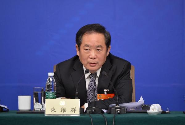 Zhu Weiqun, head of the Ethnic and Religious Affairs Committee of the National Committee of the Chinese People's Political Consultative Conference (CPPCC), answers questions from journalists at a press conference in Beijing, March 11, 2015. [Photo/Xinhua]