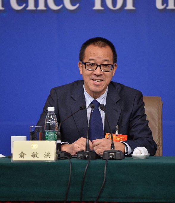 Yu Minhong, a member of the 12th National Committee of the Chinese People's Political Consultative Conference (CPPCC), answers questions at a press conference during the third session of the 12th CPPCC National Committee in Beijing, capital of China, March 11, 2015. (Xinhua/Li Xin)