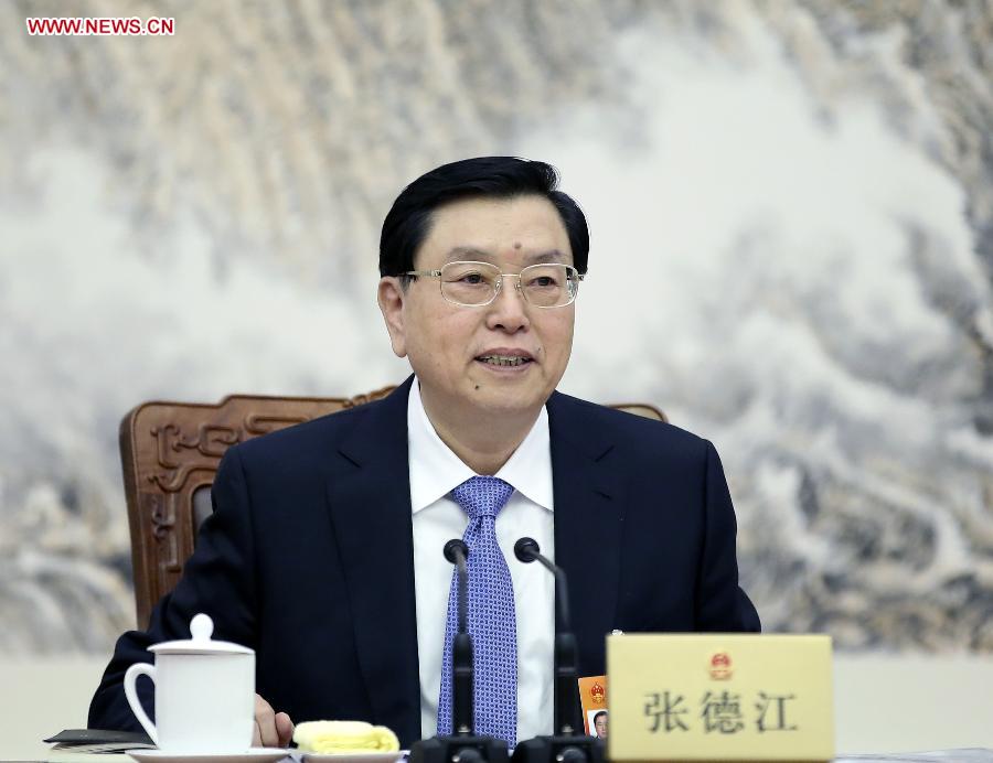 Zhang Dejiang, executive chairperson of the presidium of the third session of China's 12th National People's Congress (NPC) and chairman of the NPC Standing Committee, presides over the first meeting of the presidium's executive chairpersons at the Great Hall of the People in Beijing, capital of China, March 11, 2015. (Xinhua/Lan Hongguang)