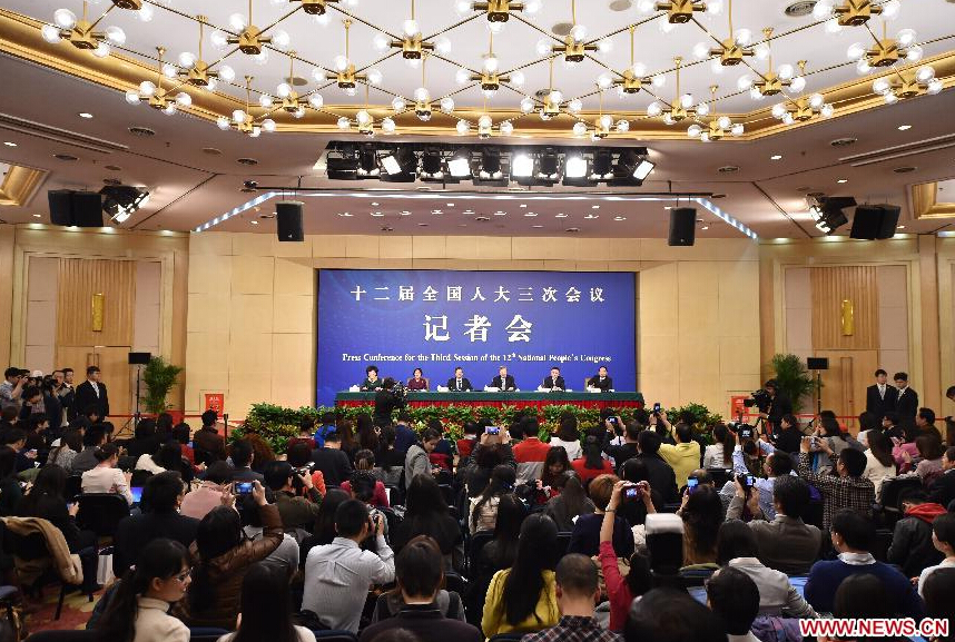 Zhou Xiaochuan, governor of the People's Bank of China and his two deputies, Yi Gang and Pan Gongsheng, as well as Jin Qi, chairperson of the board of the Silk Road Fund, give a press conference for the third session of the 12th National People's Congress (NPC)on financial reform in Beijing, capital of China, March 12, 2015. (Xinhua/Li Xin) 