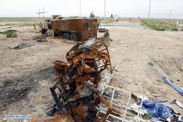 A destroyed vehicle of Islamic State (IS) is seen in the Rashad district in southwest of Kirkuk, Iraq, March 12, 2015. Kurdish security forces, known as Peshmerga, supported by U.S.-led coalition aircraft, carried out an offensive against IS sites in western and southern parts of Iraq's northern province of Kirkuk. 