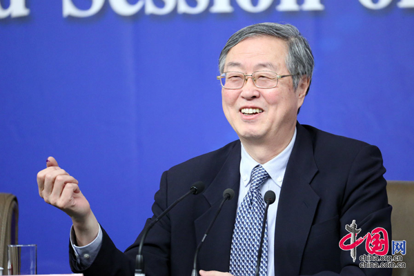 Zhou Xiaochuan, governor of People's Bank of China, takes questions from journalists at home and abroad during an ongoing press conference on March 12, 2015.