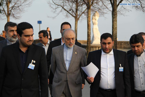 Members of Iran's delegation talks with Iran's atomic agency chief Ali Akbar Salehi in Lausanne, Switzerland, on March 18, 2015. Senior officials from Iran and the P5+1 countries (the United States, China, Russia, France, Britain, plus Germany) on Wednesday kicked off a new round of nuclear talks in the Swiss city of Lausanne. 