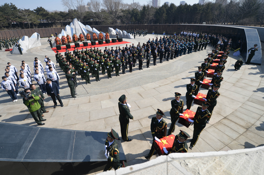 Remains of 68 Chinese soldiers killed in the 1950-53 Korean War were reburied in northeast China after they were excavated and returned from the Republic of Korea (ROK). A grand ceremony was held March 21, 2015 at Martyrs&apos; Park in Shenyang, capital city of Liaoning Province. It was attended by veterans, relatives of the soldiers and representatives from all walks of life. [Photo/Xinhua] 