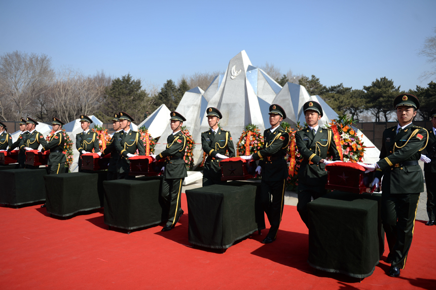 Remains of 68 Chinese soldiers killed in the 1950-53 Korean War were reburied in northeast China after they were excavated and returned from the Republic of Korea (ROK). A grand ceremony was held March 21, 2015 at Martyrs&apos; Park in Shenyang, capital city of Liaoning Province. It was attended by veterans, relatives of the soldiers and representatives from all walks of life. [Photo/Xinhua] 
