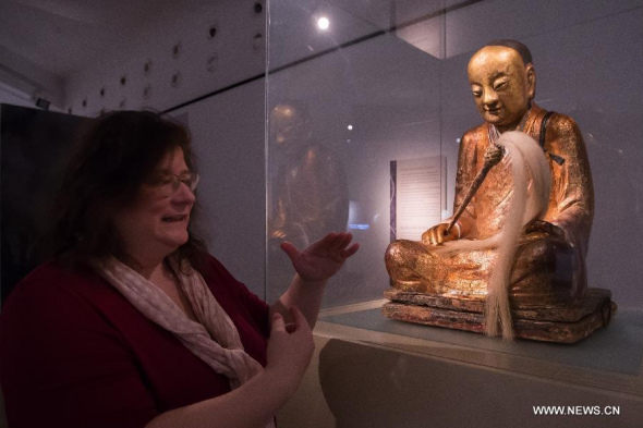 A Chinese Buddha statue with the mummified body of a Buddhist monk inside is on display at the Hungarian Natural History Museum in Budapest, Hungary on March 3, 2015. [Photo/Xinhua] 