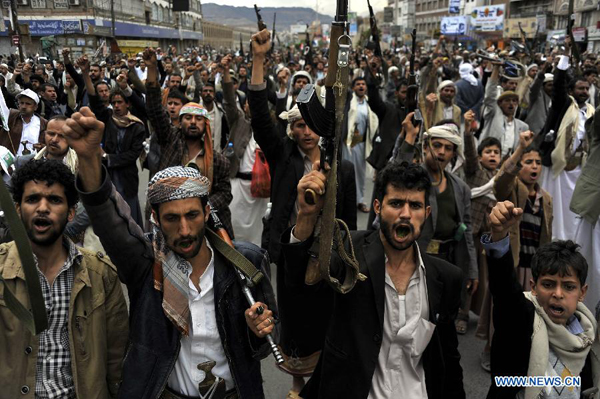 Supporters of the Shiite Houthi group shout slogans during a rally in Sanaa, Yemen, on March 26, 2015. The Shiite Houthi group organized a demonstration in Sanaa to denounce the air raid led by Saudi Arabia against the group in the capital and several other cities in Yemen.