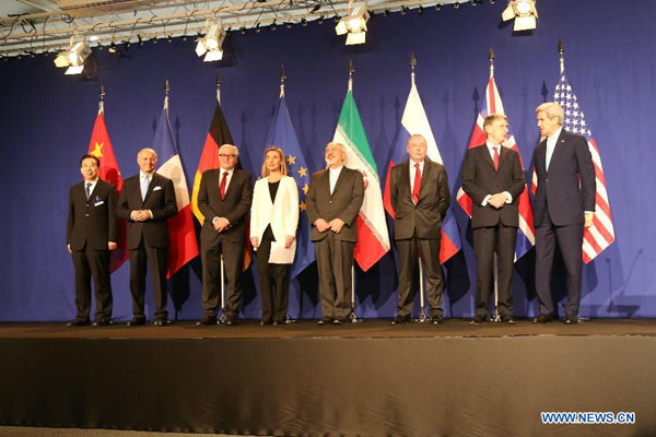 Representatives from the P5+1 countries, European Union (EU) and Iran pose for photos in Lausanne, Switzerland, on April 2, 2015. Top negotiators on Thursday concluded the Iran nuclear talks in Lausanne and reached common solutions to outstanding issues, a senior EU official said. [Photo/Xinhua]