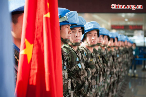 A PLA infantry battalion assembles at Jinan Yaoqiang International Airport before flying on a U.N.-chartered flight to South Sudan for a U.N. peacekeeping mission on Tuesday, April 7, 2015. [Photo by Chen Boyuan / China.org.cn]
