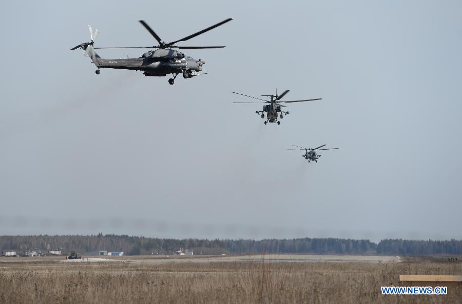 Attack helicopters Mil Mi-28 Havoc fly during the parade rehearsal dedicated to the 70th anniversary of the victory in World War II, near Kubinka military airfield in the Moscow region of Russia, April 8, 2015 [Photo/Xinhua]