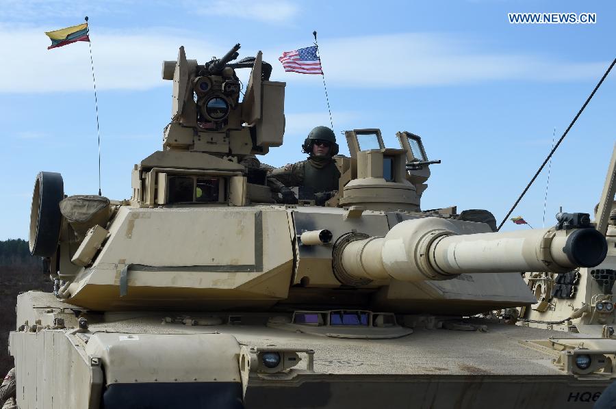A tank of U.S. troops stationed in Lithuania is seen during tank live-fire drills in Pabrade, Lithuania, on April 9, 2015. U.S. troops stationed in Lithuania held the first tank live-fire drills from April 8 to 9. [Photo/Xinhua] 