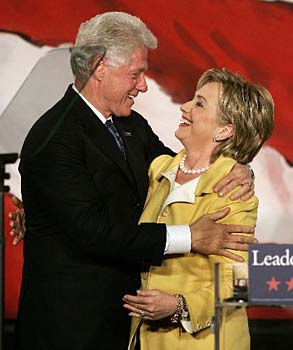 U.S. Senator Hillary Clinton receives a hug from her husband, former U.S. president Bill Clinton (L) after being re-elected during the New York State Democratic Party midterm election night celebration in New York Nov. 7, 2006. [Photo/Xinhua]