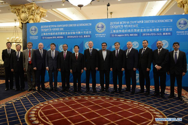 Chinese State Councilor Guo Shengkun (7th L) and other representatives pose for group photos during the 10th meeting of the Shanghai Cooperation Organization (SCO) security council secretaries in Moscow, Russia, April 14, 2015. China is willing to coordinate with all parties and strengthen the cooperation on law enforcement security under the framework of SCO, visiting Chinese State Councilor Guo Shengkun said Tuesday. [Photo/Xinhua]