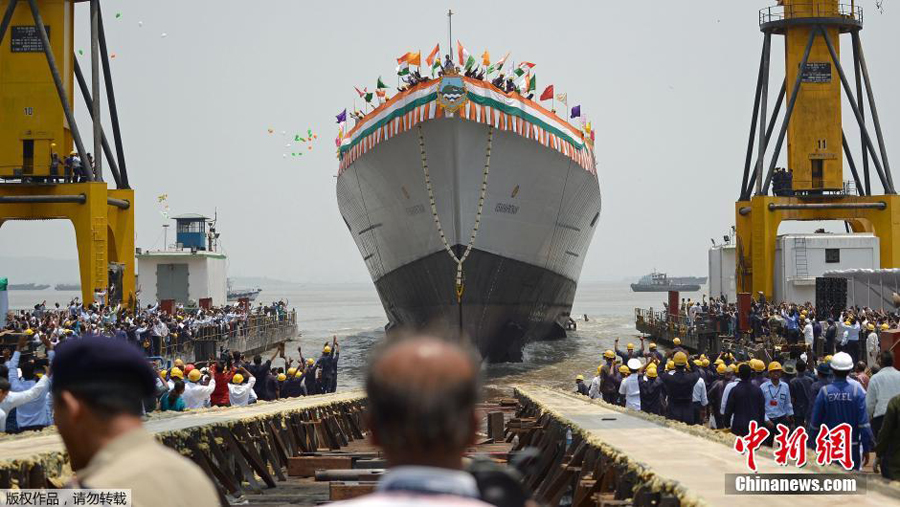 India's new naval stealth destroyer Visakhapatnam sails into the Arabian Sea during its launch at Mazagon Dock in Mumbai, India, April 20, 2015. The new warship, Visakhapatnam, is named after a port city in the southern Indian state of Andhra Pradesh and it will be able to operate in nuclear, biological and chemical atmosphere, sources said. (Xinhua