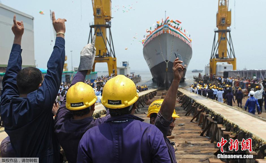 India's new naval stealth destroyer Visakhapatnam sails into the Arabian Sea during its launch at Mazagon Dock in Mumbai, India, April 20, 2015. The new warship, Visakhapatnam, is named after a port city in the southern Indian state of Andhra Pradesh and it will be able to operate in nuclear, biological and chemical atmosphere, sources said. (Xinhua