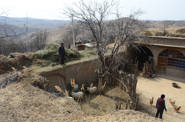 Wang Minghou was one of only five people in March who decided to continue living in the village of Gedongmao, Shaanxi province.[Photo by Wang Jian/for China Daily]