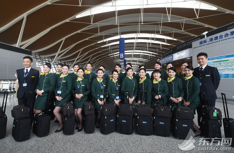 The group photo taken on May 7, 2015, shows the flight attendants from Taiwan who have joined Shanghai's budget carrier Spring Airlines. [Photo: eastday.com] 