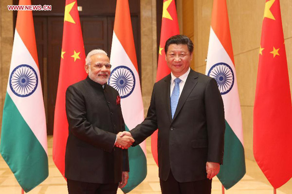 Chinese President Xi Jinping (R) meets with visiting Indian Prime Minister Narendra Modi in Xi'an, capital of northwest China's Shaanxi Province, May 14, 2015. [Photo/Xinhua]