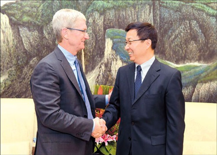 Shanghai Party Secretary Han Zheng meets with Apple Inc’s Chief Executive Tim Cook yesterday during his sixth visit to China. Cook said Apple grows with Shanghai. — Ti Gong