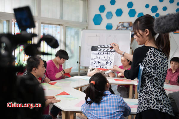 The short film 'Action Speaks Louder than Words' is the first-ever motion picture to be entirely funded by a residential community in Beijing. [Photo by Chen Boyuan / China.org.cn]