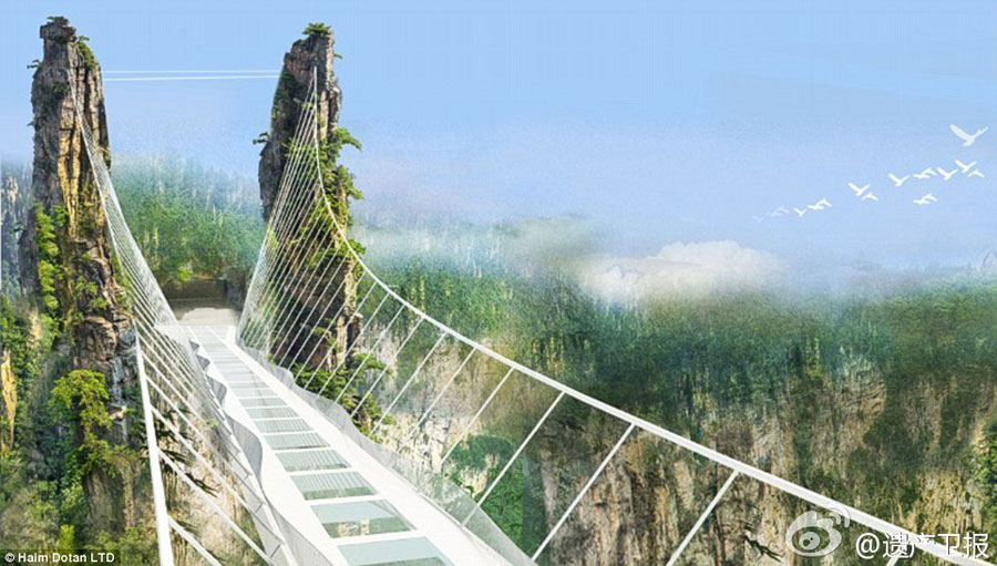 Following the world's longest cantilever bridge in Chongqing, another record-breaking glass bridge will open in Zhangjiajie, Hunan Province in July. The structure, which is 430 meters long, six meters wide and 300 meters above the valley floor, can carry 800 people. [Weibo.com]