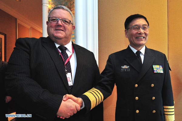 Admiral Sun Jianguo (R), vice chief of staff of China's People's Liberation Army (PLA), meets with Gerry Brownlee, New Zealand's Defence Minister, on the sidelines of the 14th Shangri-La Dialogue in Singapore, on May 29, 2015. (Xinhua/Then Chih Wey) 