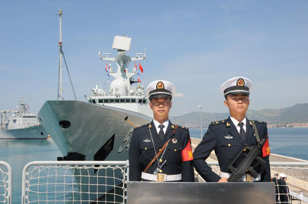 Chinese navy soldiers stand on the deck of Weishanhu missile frigate as it docks in the port of Rola, Sprit, Croatia, June 1, 2015. The 19th Chinese naval escort fleets started a five-day goodwill visit to Croatia on Monday. [Photo/Xinhua]