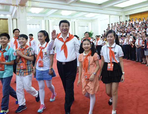 Chinese President Xi Jinping (3rd R front) and senior leader of the Communist Party of China Liu Yunshan meet with representatives attending the 7th National Congress of the Chinese Young Pioneers (CYP) in Beijing, capital of China, June 1, 2015. The CYP's 7th national congress opened here on Monday. [Photo: Xinhua]
