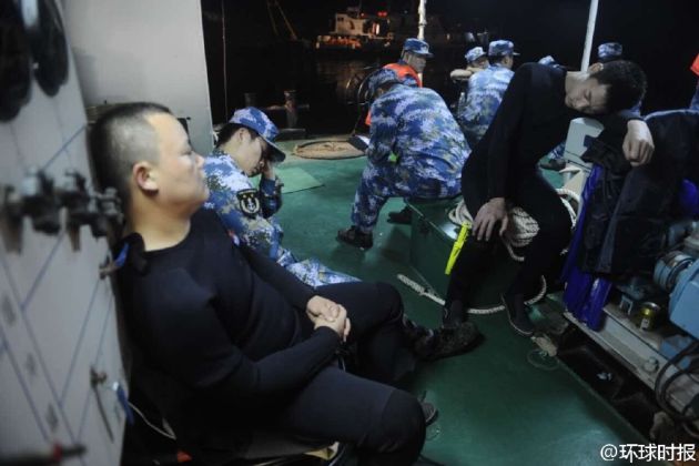 On the morning of Wednesday, June 3, several frogmen from the Chinese armed forces take a rest after pushing themselves to their limits in hours of stressful rescue dives. A total of 140 divers have been working day and night in search and rescue efforts after a passenger ship carrying 456 people sank on the Yangtze River Monday night.