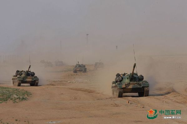 The troops participating in the drill maneuver on their way to the Zhurihe training base in North China's Inner Mongolia Autonomous Region.