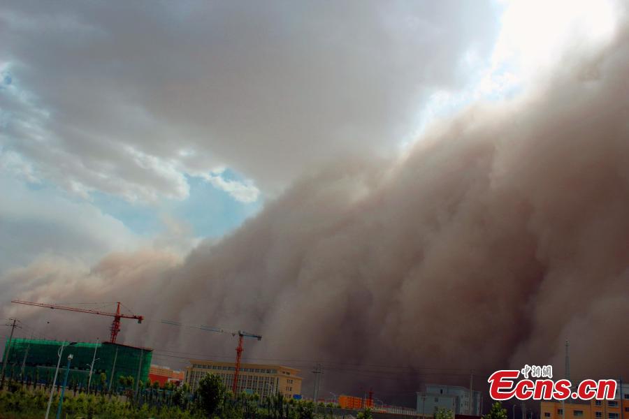 A strong sand storm hits the Hetian area in Xinjiang Uygur autonomous region on June 9, 2015. 