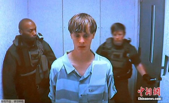 Dylann Roof, a 21-year-old white man, is arrested on Thursday and charged with nine counts of murder for the massacre at the black church. [Photo/Chinanews.com]