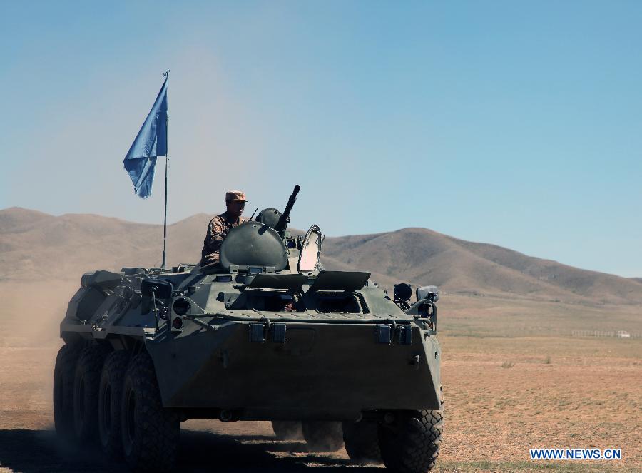 Soldiers attend the Exercise Khaan Quest at a military base near Ulan Bator, Mongolia, June 24, 2015. More than 1,200 military personnel from 23 nations, including Mongolia, the United States, China, France, Japan and others, participated in the training exercises focused on peacekeeping operations. This year's exercises began on June 20 and will last until July 1. [Xinhua]