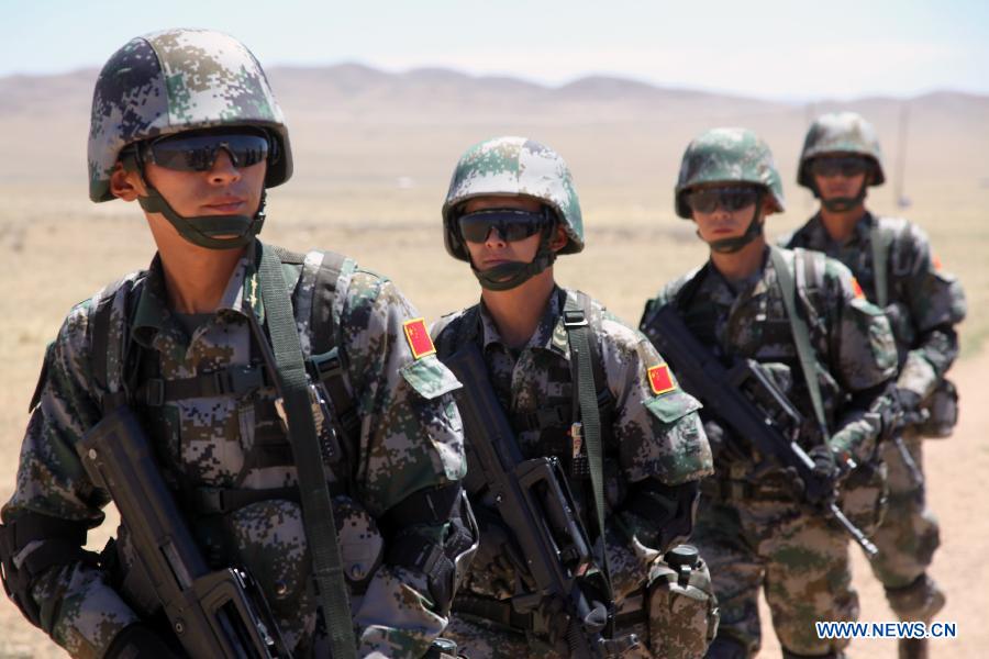 Chinese soldiers attend the Exercise Khaan Quest at a military base near Ulan Bator, Mongolia, June 24, 2015. More than 1,200 military personnel from 23 nations, including Mongolia, the United States, China, France, Japan and others, participated in the training exercises focused on peacekeeping operations. This year's exercises began on June 20 and will last until July 1. [Xinhua]