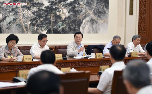 Zhang Dejiang (C rear), chairman of the Standing Committee of China's National People's Congress (NPC), attends a panel session of the 15th meeting of the 12th NPC Standing Committee, in Beijing, China, June 25, 2015. [Photo/Xinhua] 