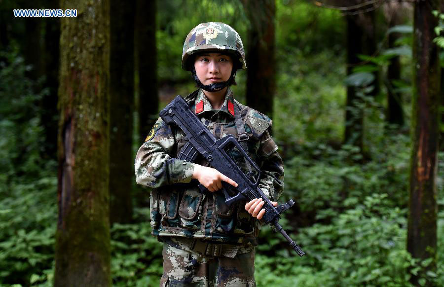 Zhang Liu takes part in a drilling in the jungle at the border area near Myanmar in Dehong Dai-Jingpo autonomous prefecture, Southwest China's Yunnan province, June 24, 2015.