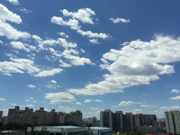 In the first six months of 2015, Beijing's air quality improved significantly, registering fewer air pollutants and more clear days.