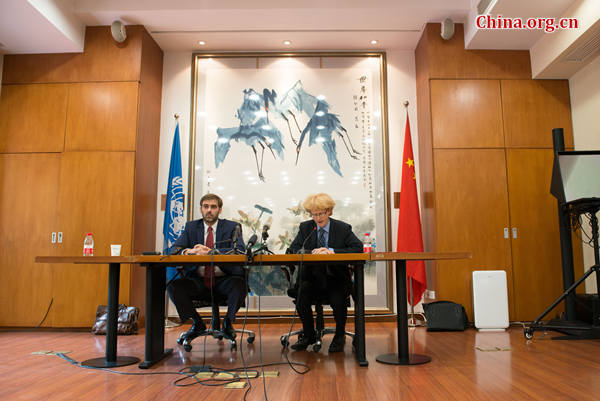 Juan Pablo Bohoslavsky (L), the United Nations Independent Expert on foreign debt, holds a press conference on Monday, July 6, 2015, at the U.N. China headquarters in Beijing, to brief on the achievement of his latest China visit. [Photo by Chen Boyuan / China.org.cn]