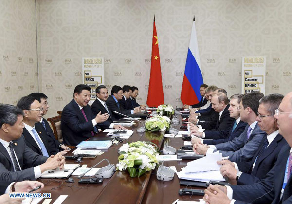 Chinese President Xi Jinping (4th L) meets with his Russian counterpart Vladimir Putin (5th R) in Ufa, Russia, July 8, 2015. [Xinhua]