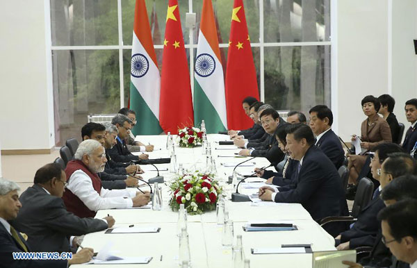 Chinese President Xi Jinping meets with Indian Prime Minister Narendra Modi in Ufa, Russia, July 8, 2015. [Xinhua]